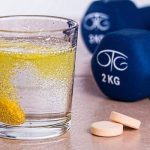 supplement and dumbbell
