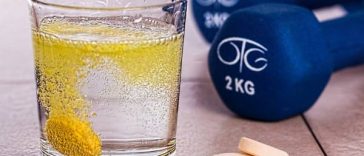 supplement and dumbbell