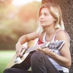 woman playing guitar