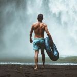 man at waterfall