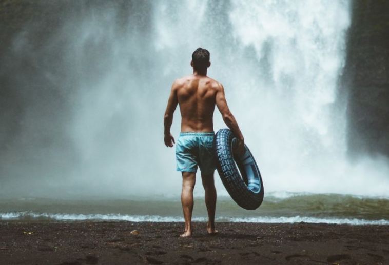 man at waterfall